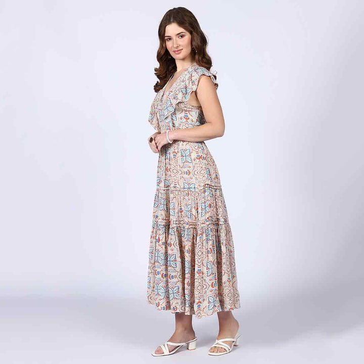 Side view of a woman wearing a beige multicolour printed maxi dress.