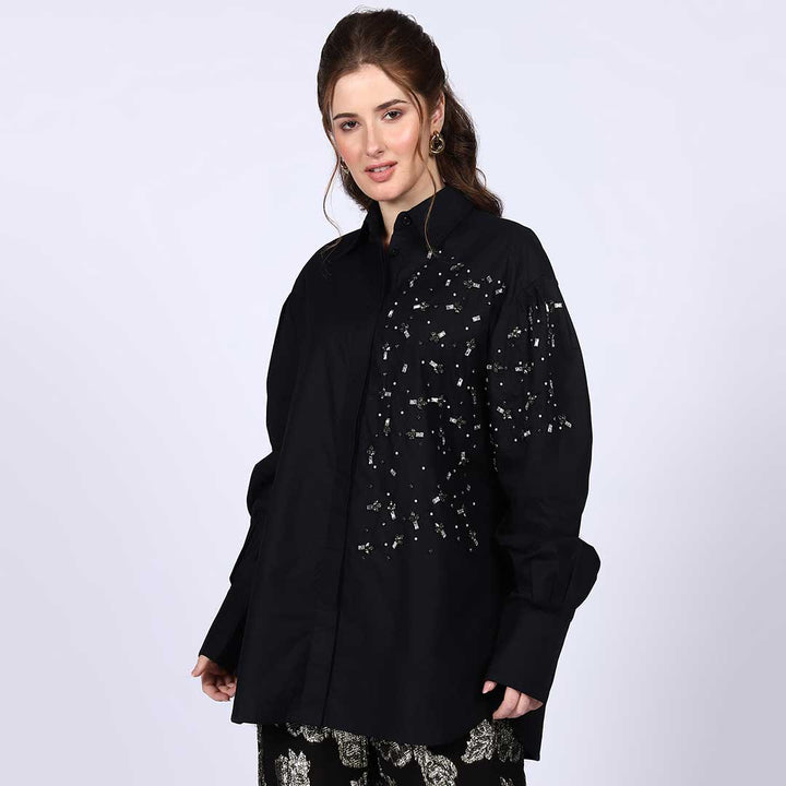 Black cotton shirt with rhinestone and pearl embellished collar, shown flat.