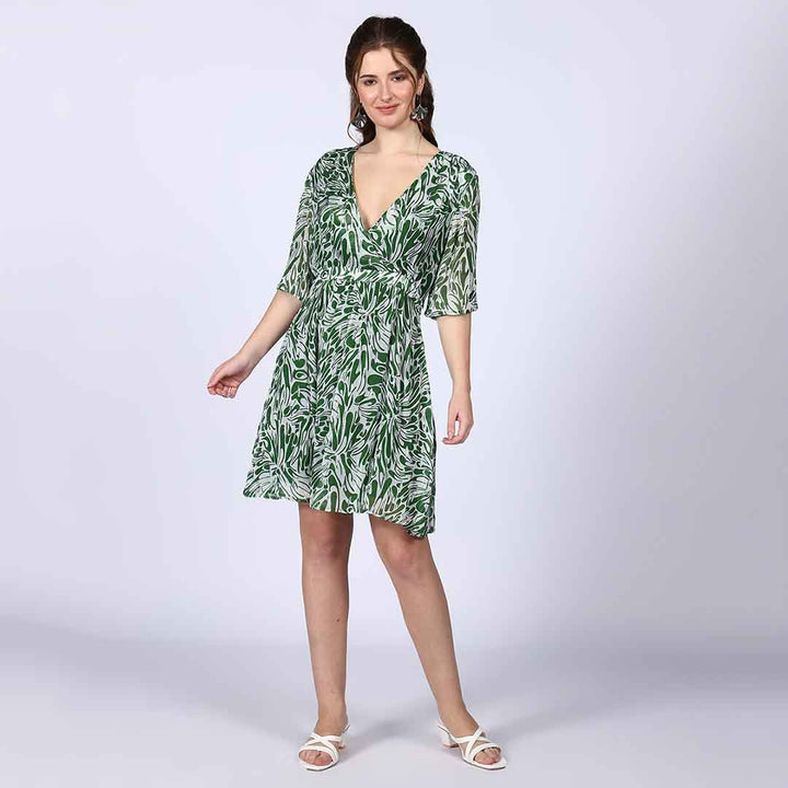 Close-up of the green abstract print on a viscose mini dress.