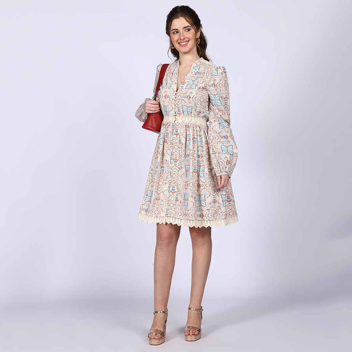 Close-up of the multicolour print on an ivory cotton poplin dress.