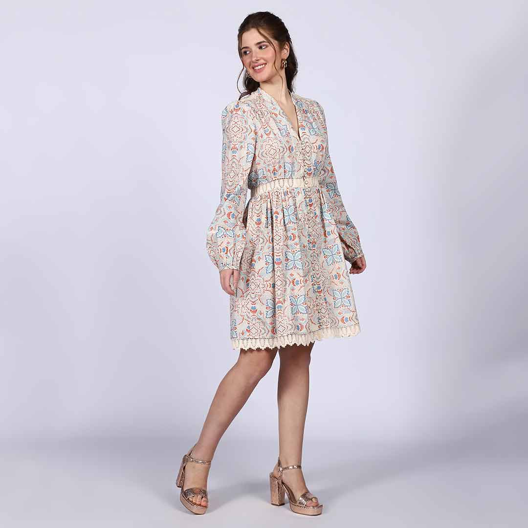 Side view of a woman wearing an ivory multicolour printed dress.