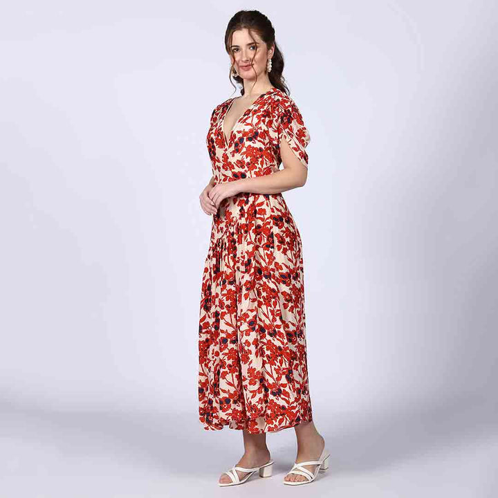 Back view of a woman wearing an ivory viscose dress with red detailing.