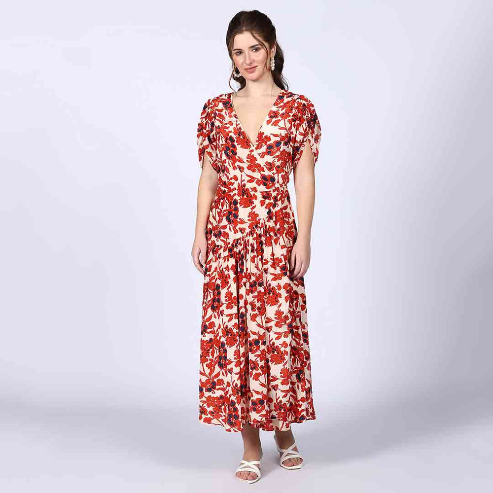 Close-up of the deep V-neckline and red detailing on an ivory viscose dress.