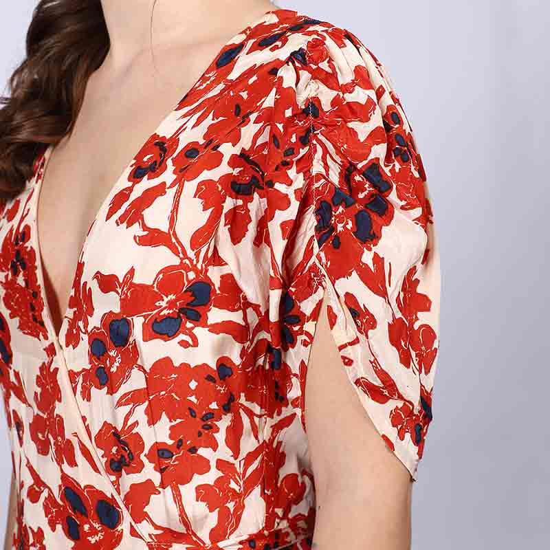 Additional detail shot of an ivory red deep V-neck viscose dress.