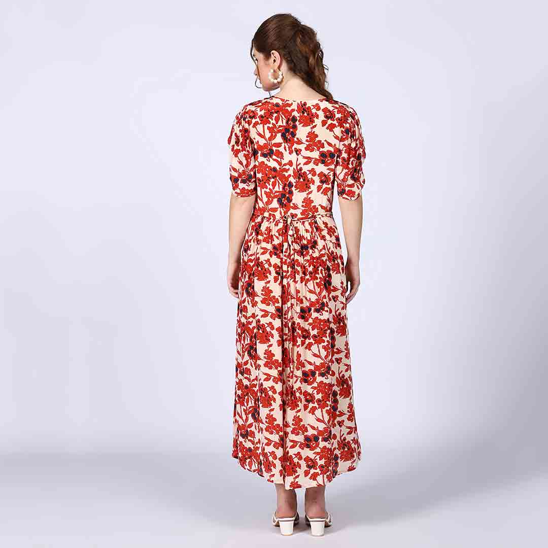 Full-length shot of a woman wearing an ivory red deep V-neck viscose dress.