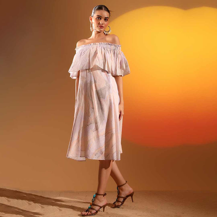 Side view of a woman wearing a lilac off-shoulder midi dress.