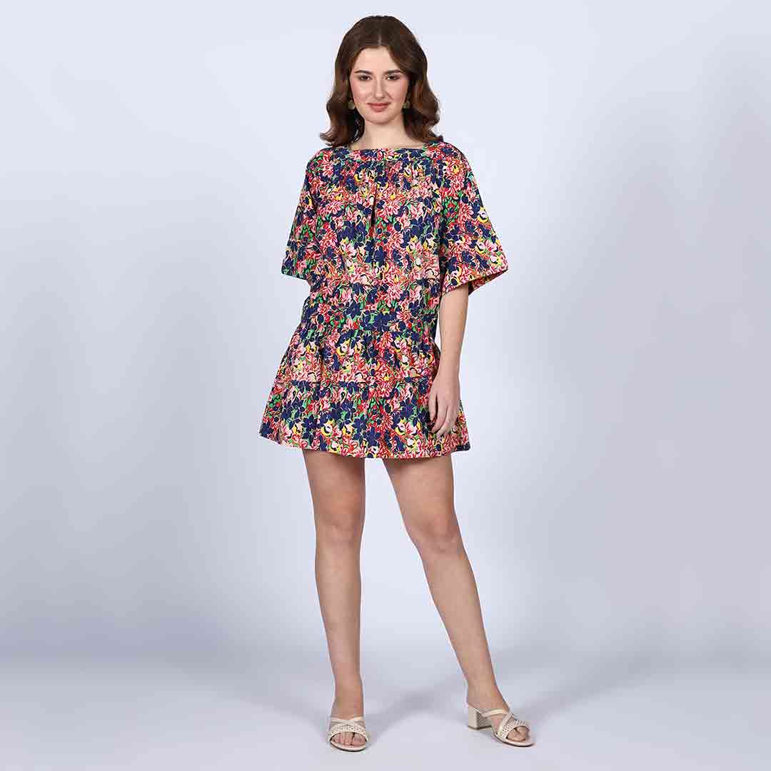 Woman wearing a multicolour floral-print short dress with dropped-shoulder sleeves.
