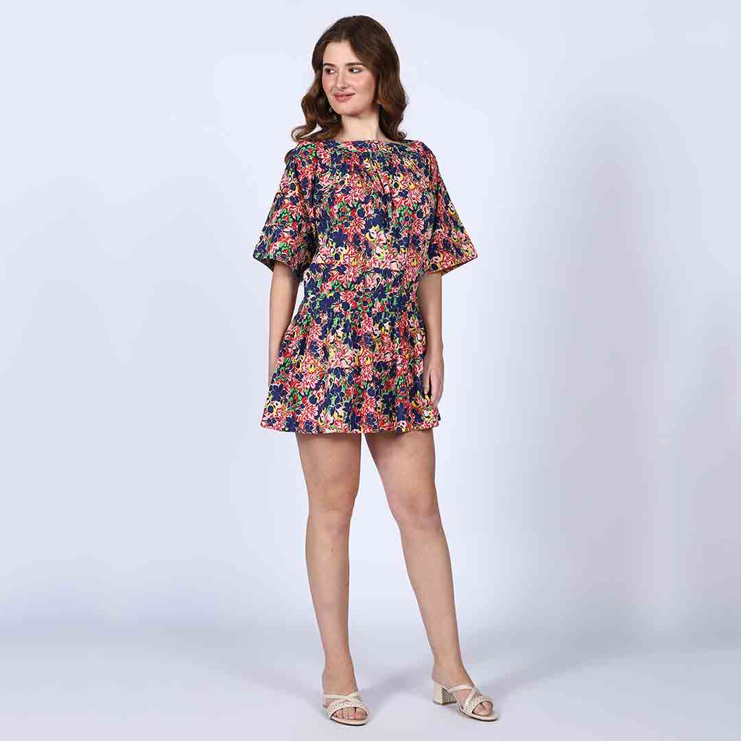 Alternate side view of a woman wearing a multicolour short dress.