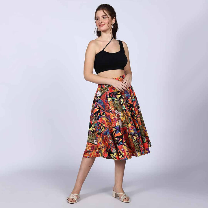 Woman wearing a multicolour abstract-print pleated skirt.