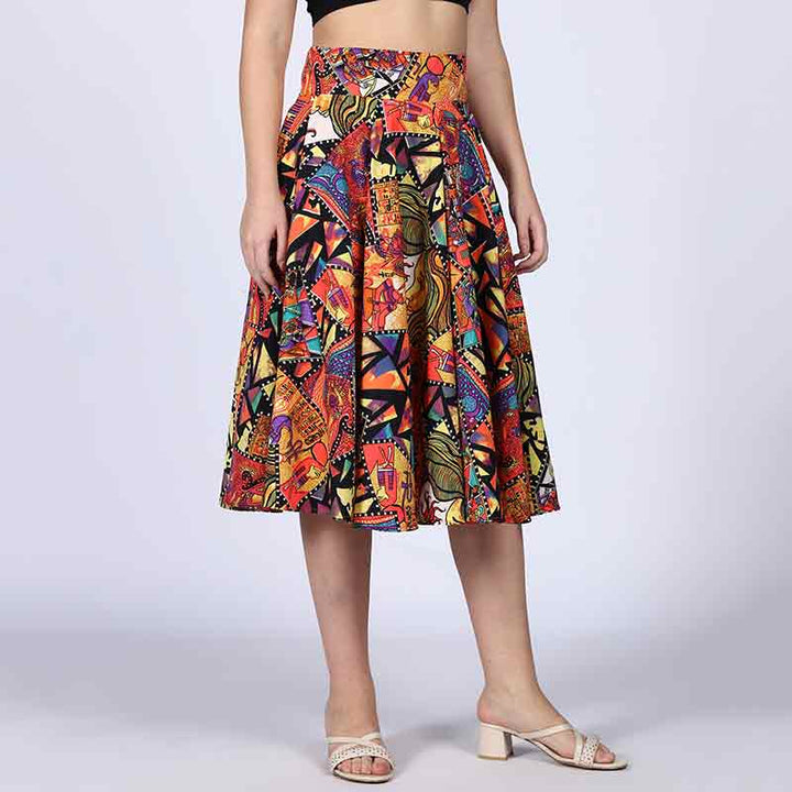 Side view of a woman wearing a multicolour printed pleated skirt.