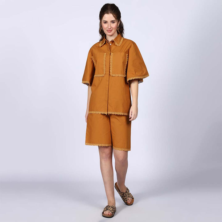 Woman wearing a solid mustard-yellow cotton poplin co-ord set.