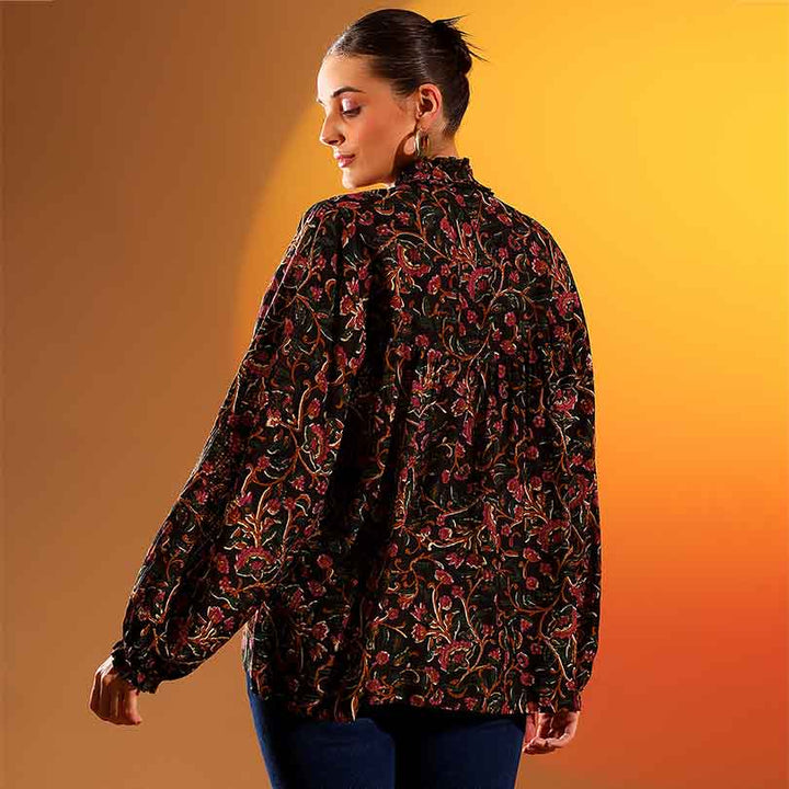 Back view of a woman wearing an onyx multicolour floral-print top.