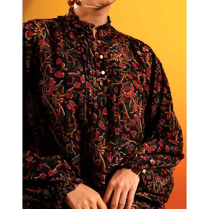Close-up of the floral print and pintuck placket on an onyx dobby-weave top.