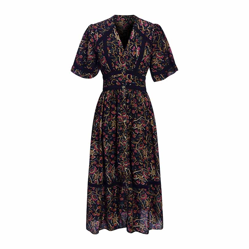 Woman wearing a black printed dobby-weave midi dress.