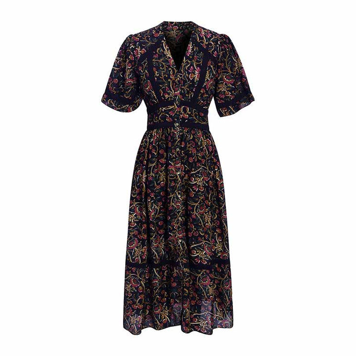 Woman wearing a black printed dobby-weave midi dress.