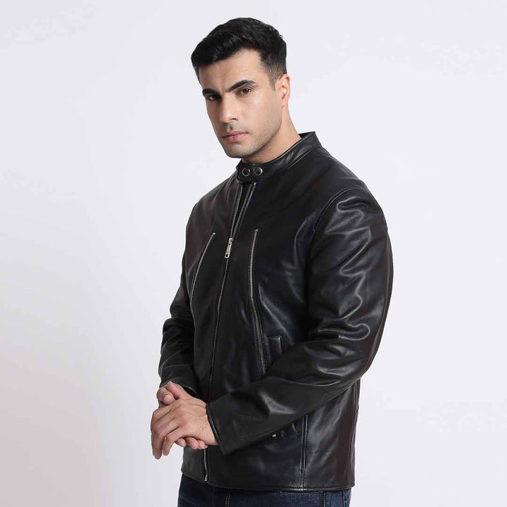 Side view of a man wearing a black leather cafe racer jacket.