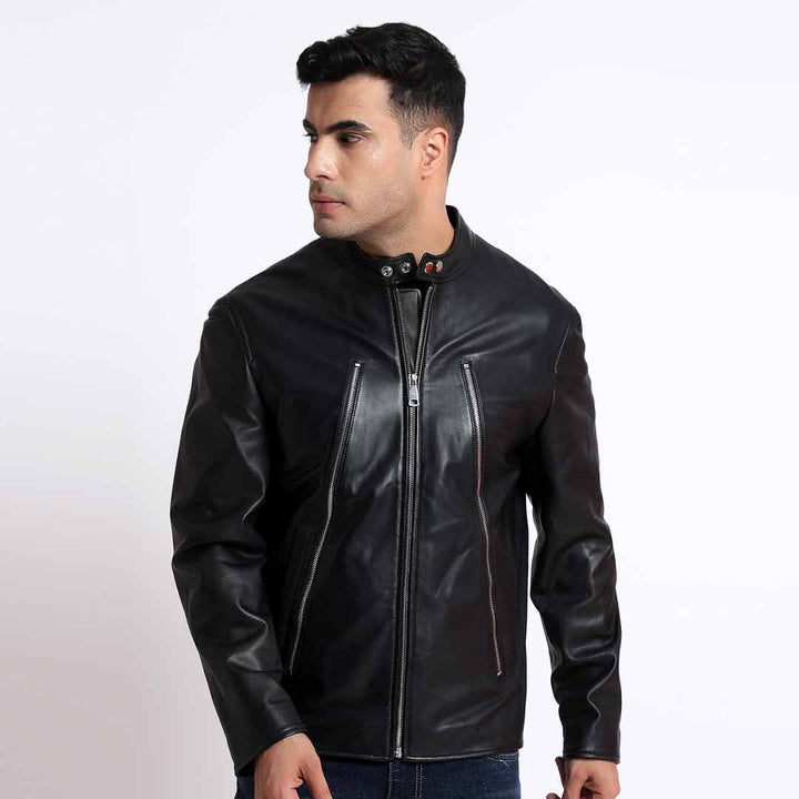 Three-quarter view of a man wearing a black leather cafe racer jacket.