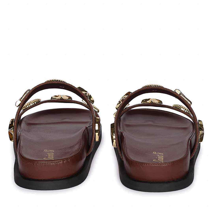Pair of brown sandals with decorative straps on a white background - Back View