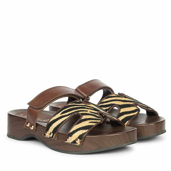 Womens Brown sandals with zebra pattern straps on a white background - Angled Pair