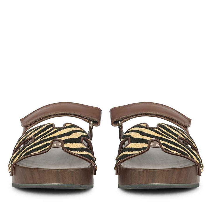 Pair of sandals with zebra pattern straps on a white background - Front