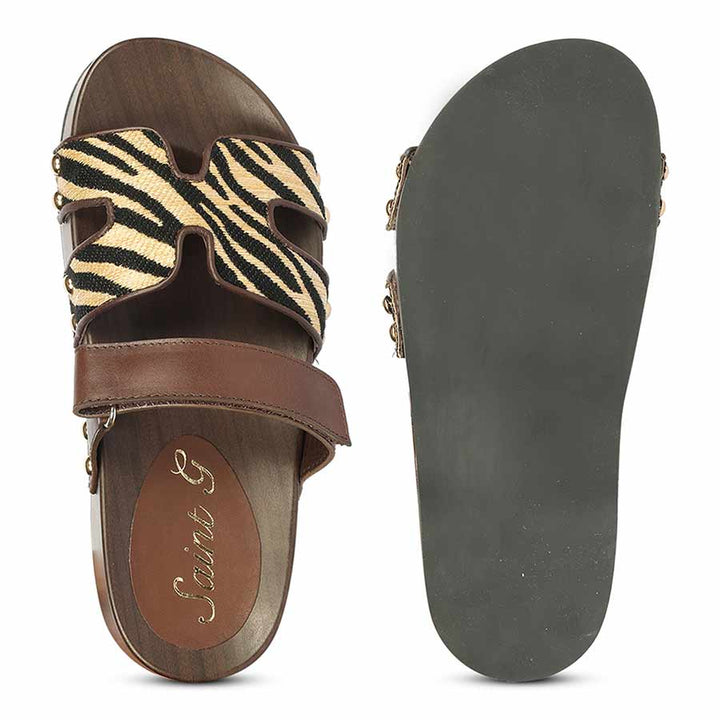 Sandal with zebra pattern strap and brown sole on a white background - Sole View