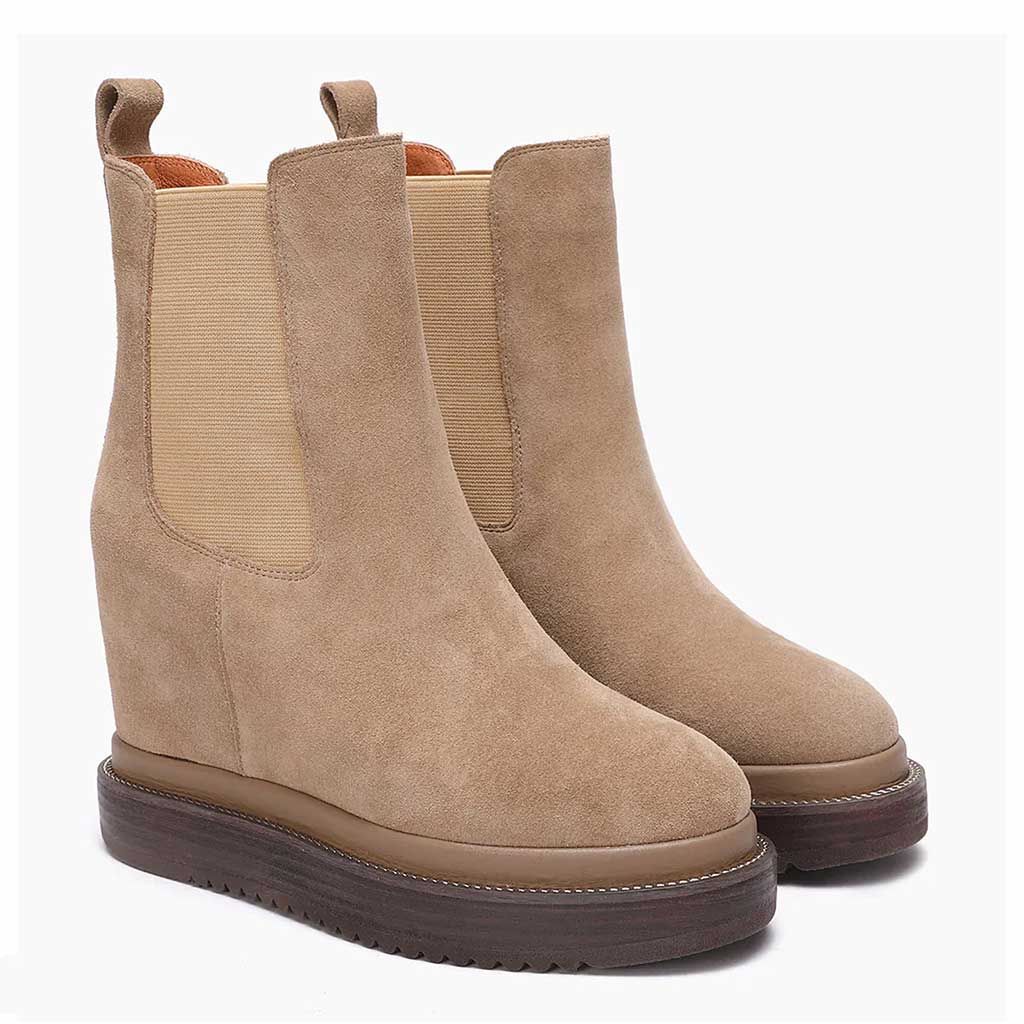 Sand suede wedge ankle boots for women with elastic side panel, angled view