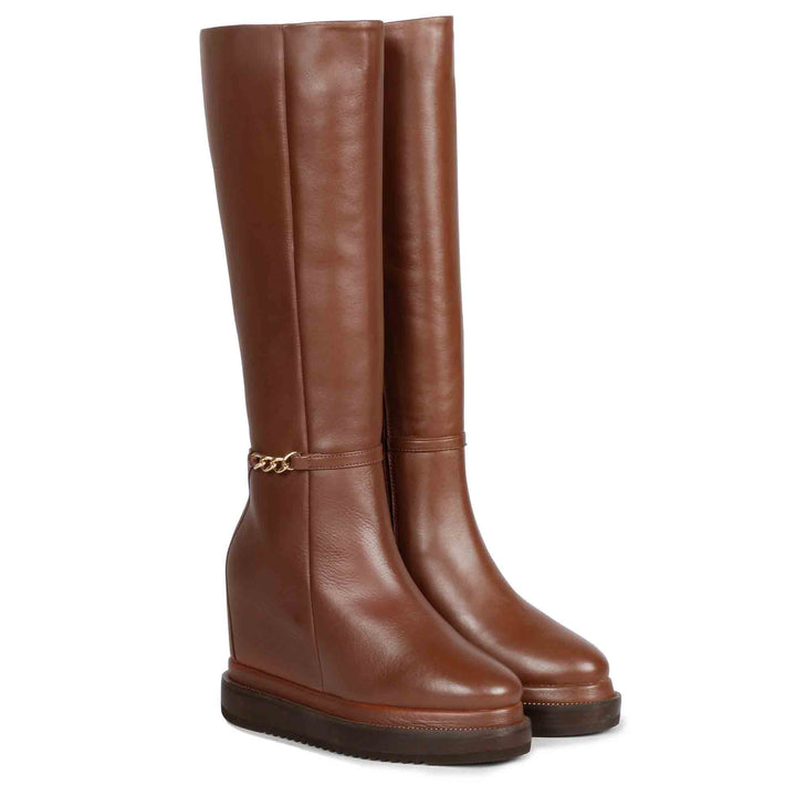 Tan leather wedge long boots for women, front angled view