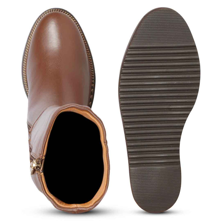 Sole and inside wedge of womens tan leather long boots
