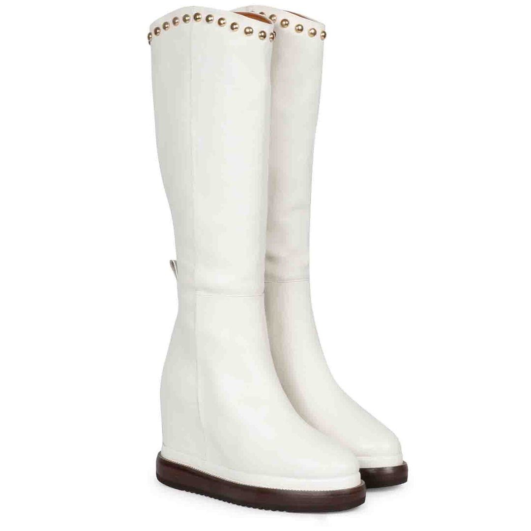White leather studded wedge long boots for women, front angled view