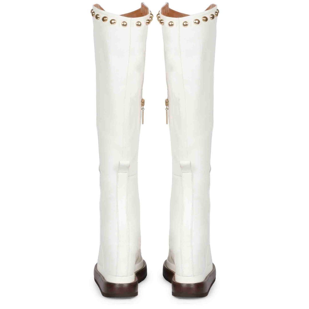 Pair of white leather wedge long boots for women, back view