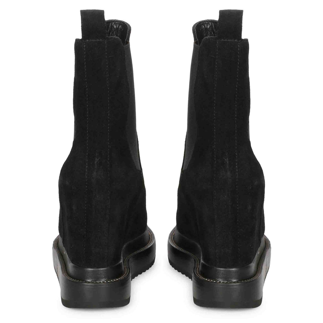 Pair of ladies black wedge ankle boots, back view