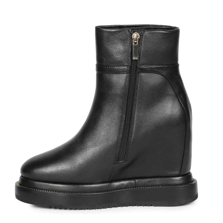Womens black leather wedge ankle boots, angled view