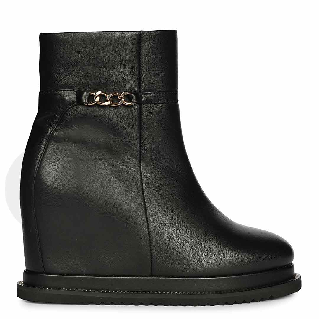 Womens black leather wedge ankle boots with chain detail, side view