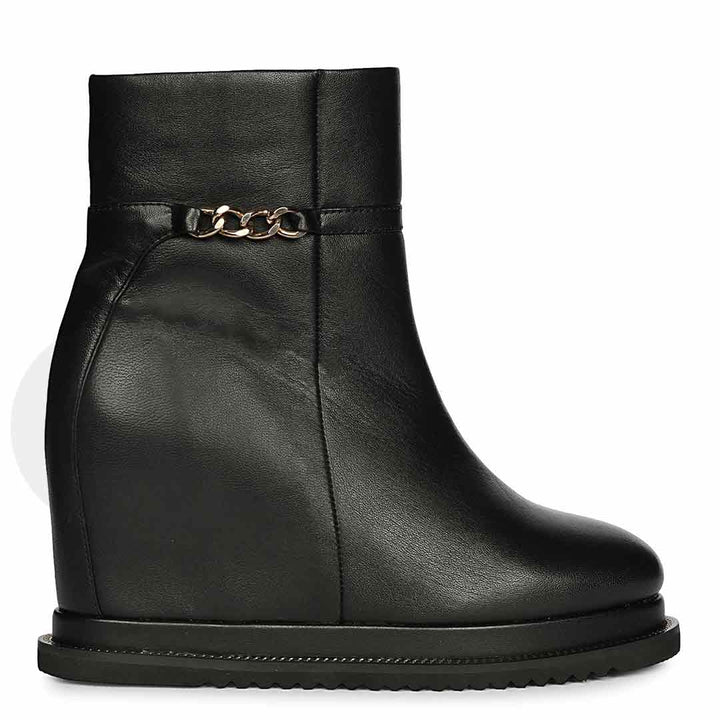 Womens black leather wedge ankle boots with chain detail, side view