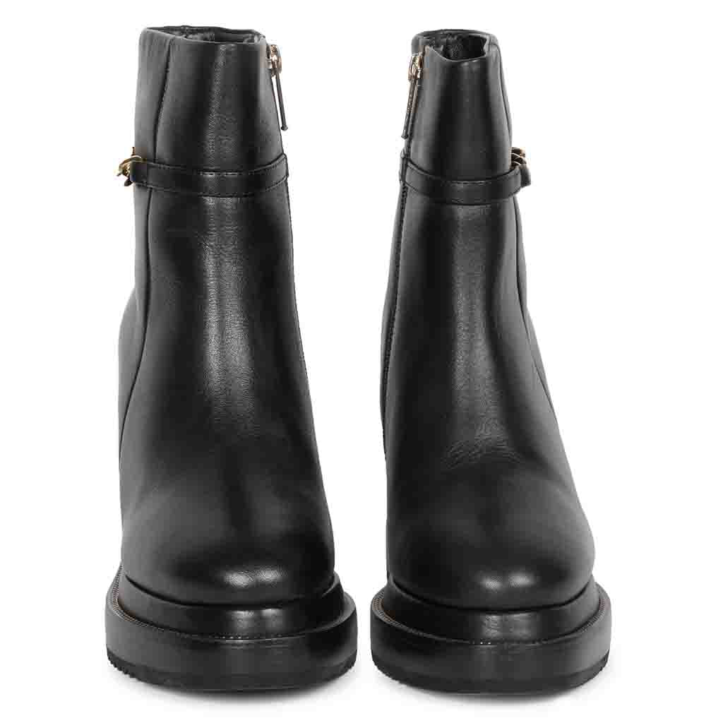 Womens black leather wedge ankle boots, front angled view