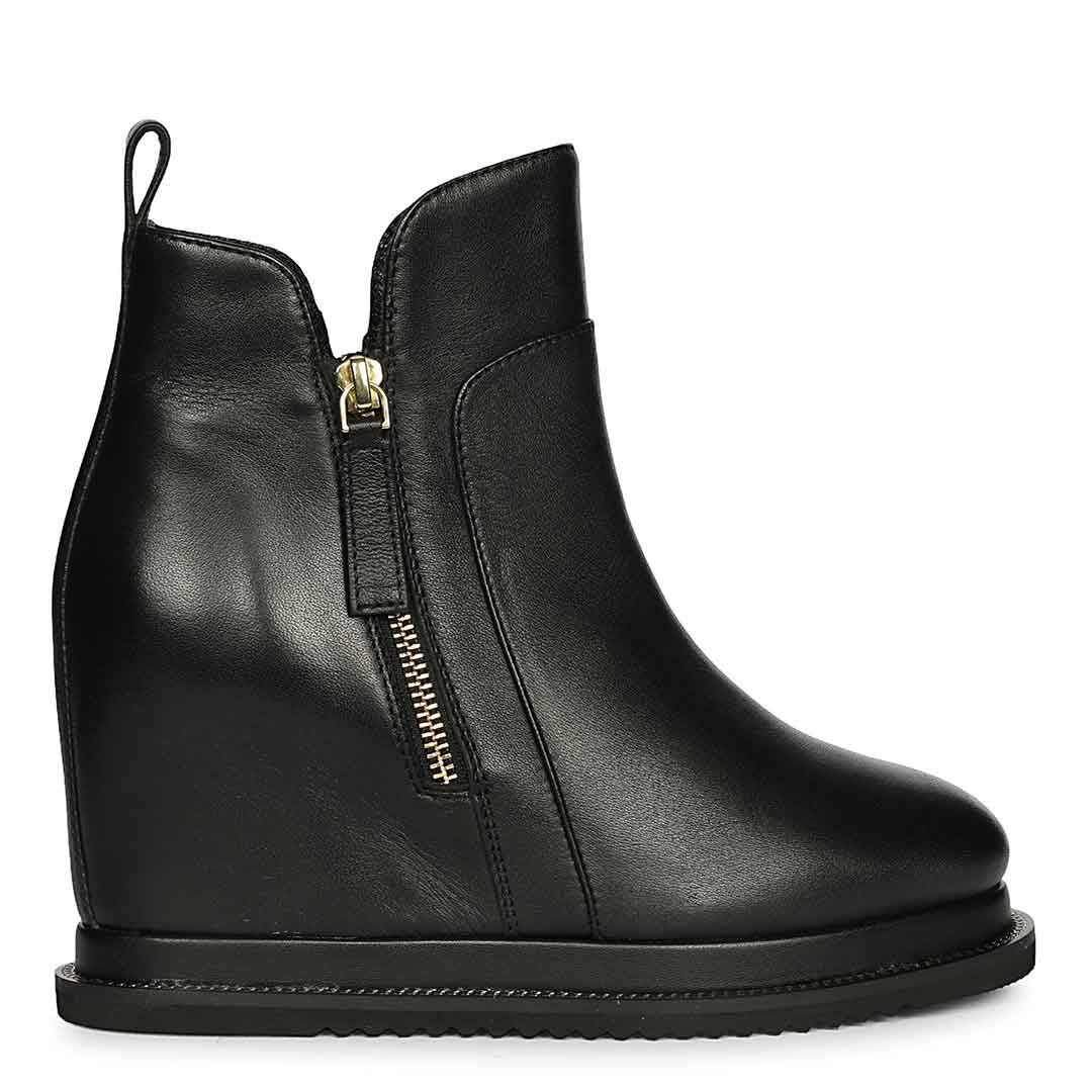 Womens black leather wedge ankle boots with gold side zip, side view