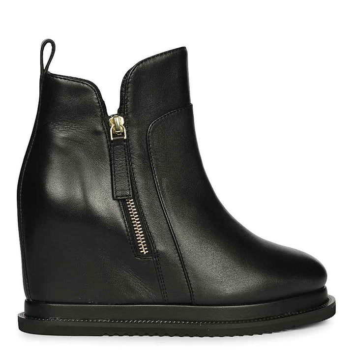 Womens black leather wedge ankle boots with gold side zip, side view