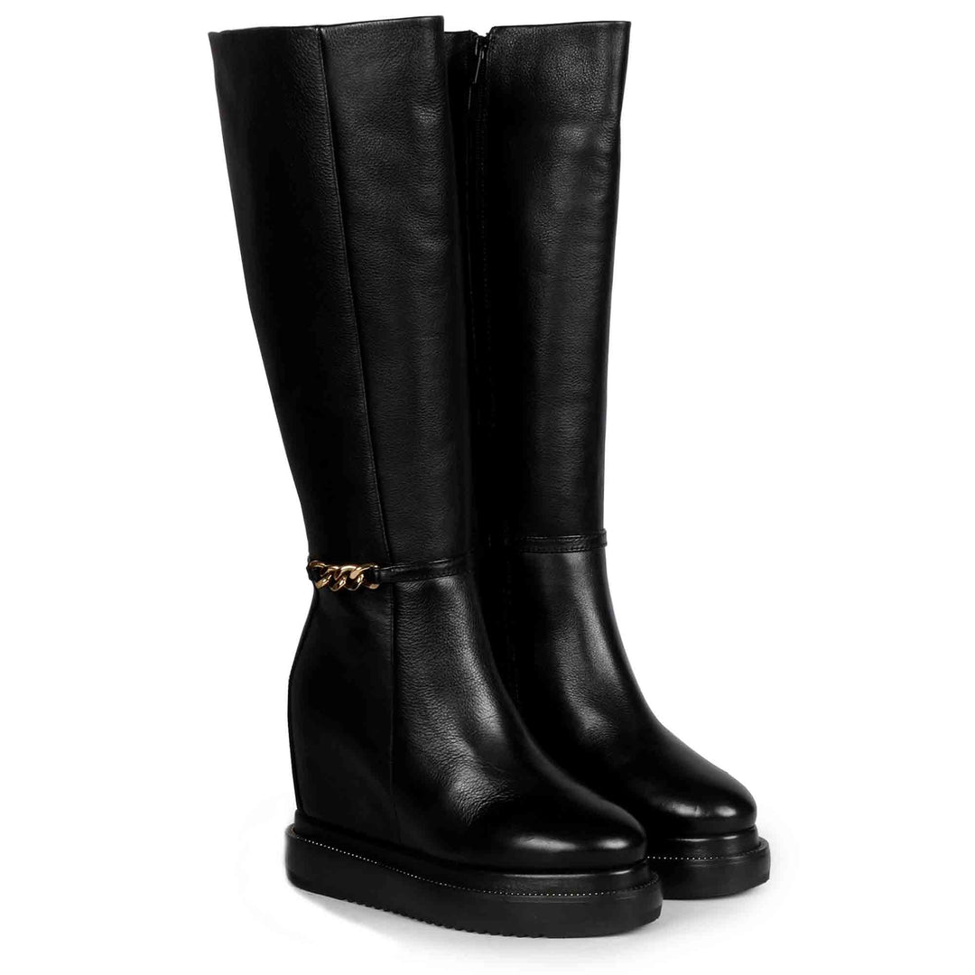 Womens black leather wedge long boots with gold chain trim, front view