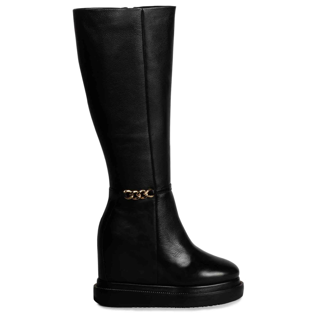 Womens black leather wedge long boots with gold chain detail, side view
