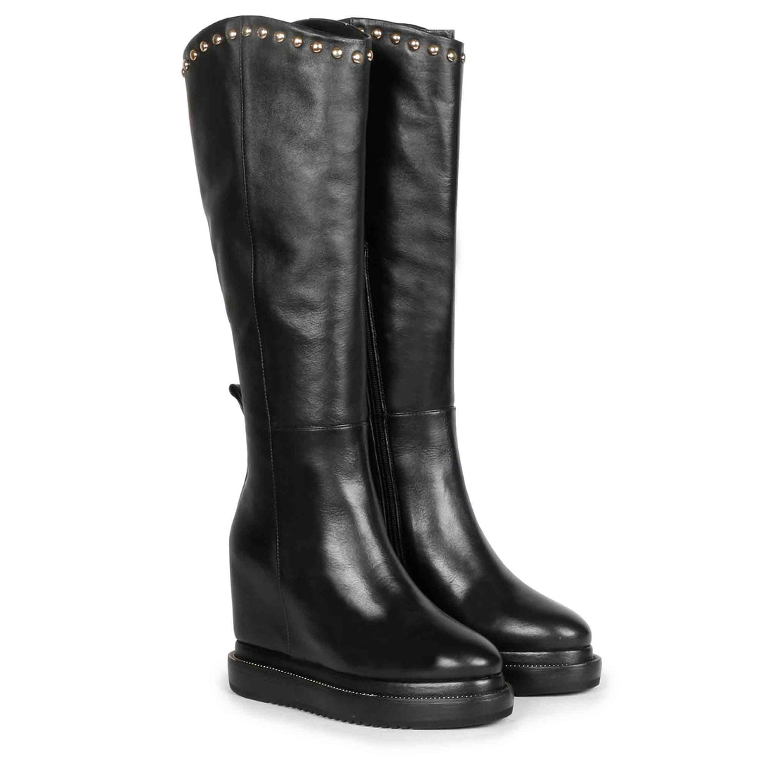 Womens black studded leather wedge long boots, front angled view