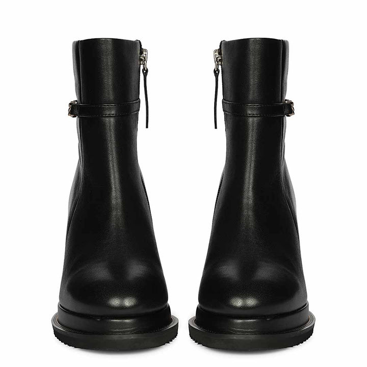 Pair of womens black leather wedge ankle boots, front view
