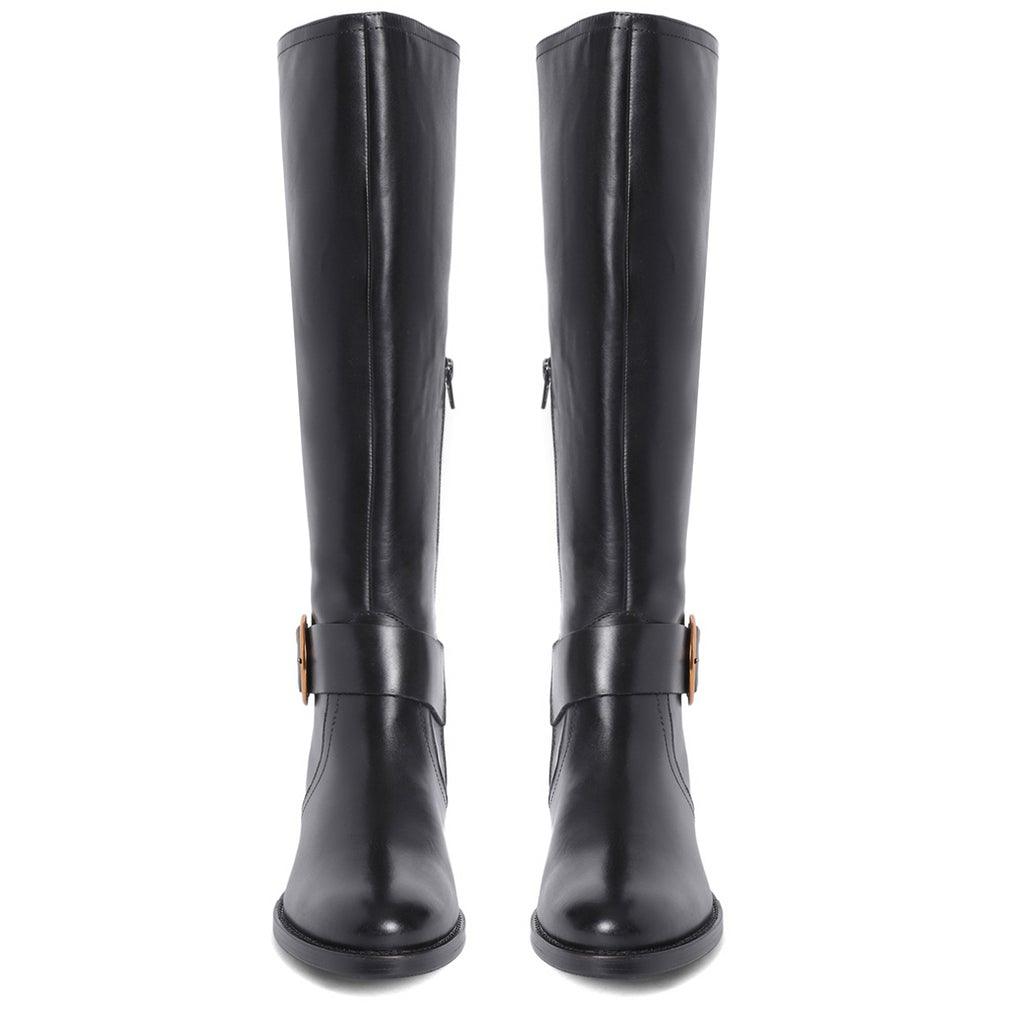 Women's black leather knee high boots, front pair view of decorative gold buckle