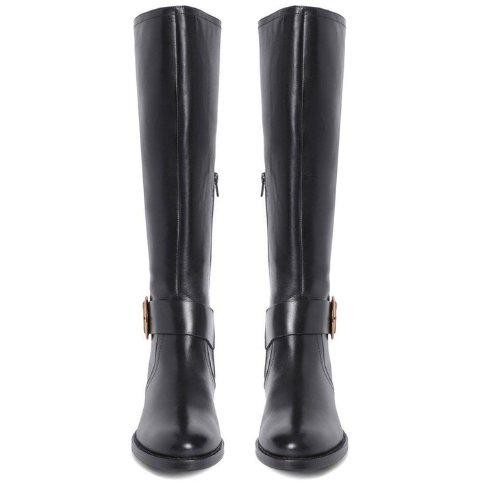 Women's black leather knee high boots, front pair view of decorative gold buckle