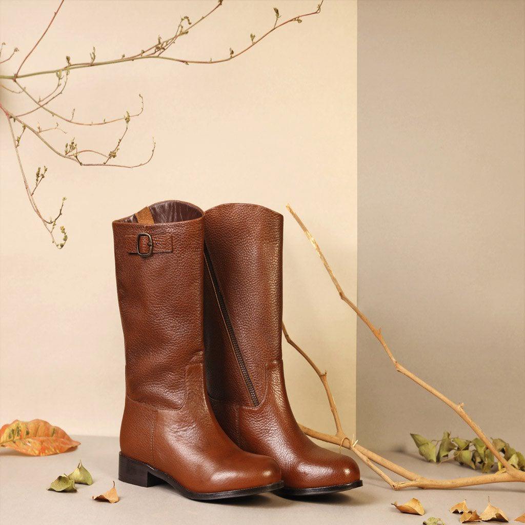 Women's tan leather calf boots by Saint Martina, styled editorial lifestyle shot