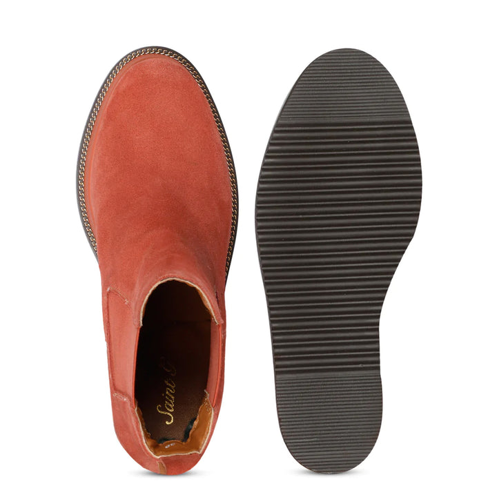 Sole and inside wedge of womens tan leather ankle boots